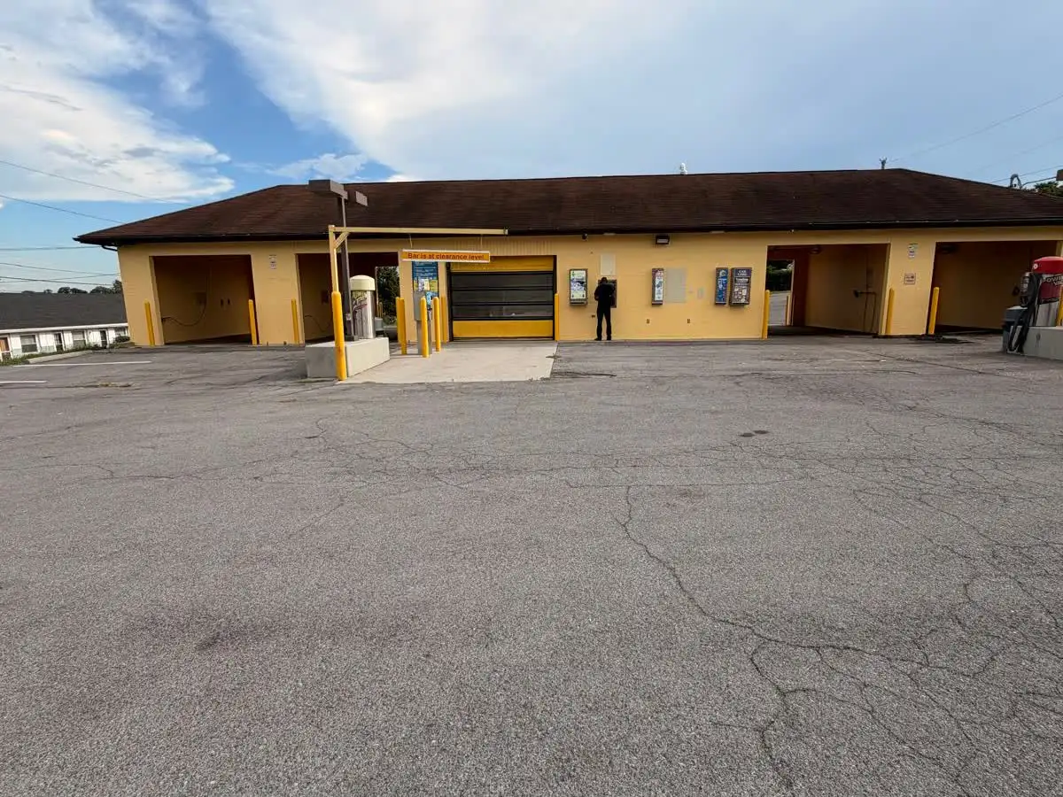 A closer view of the LIMS Car Wash entrance and front wash bays.