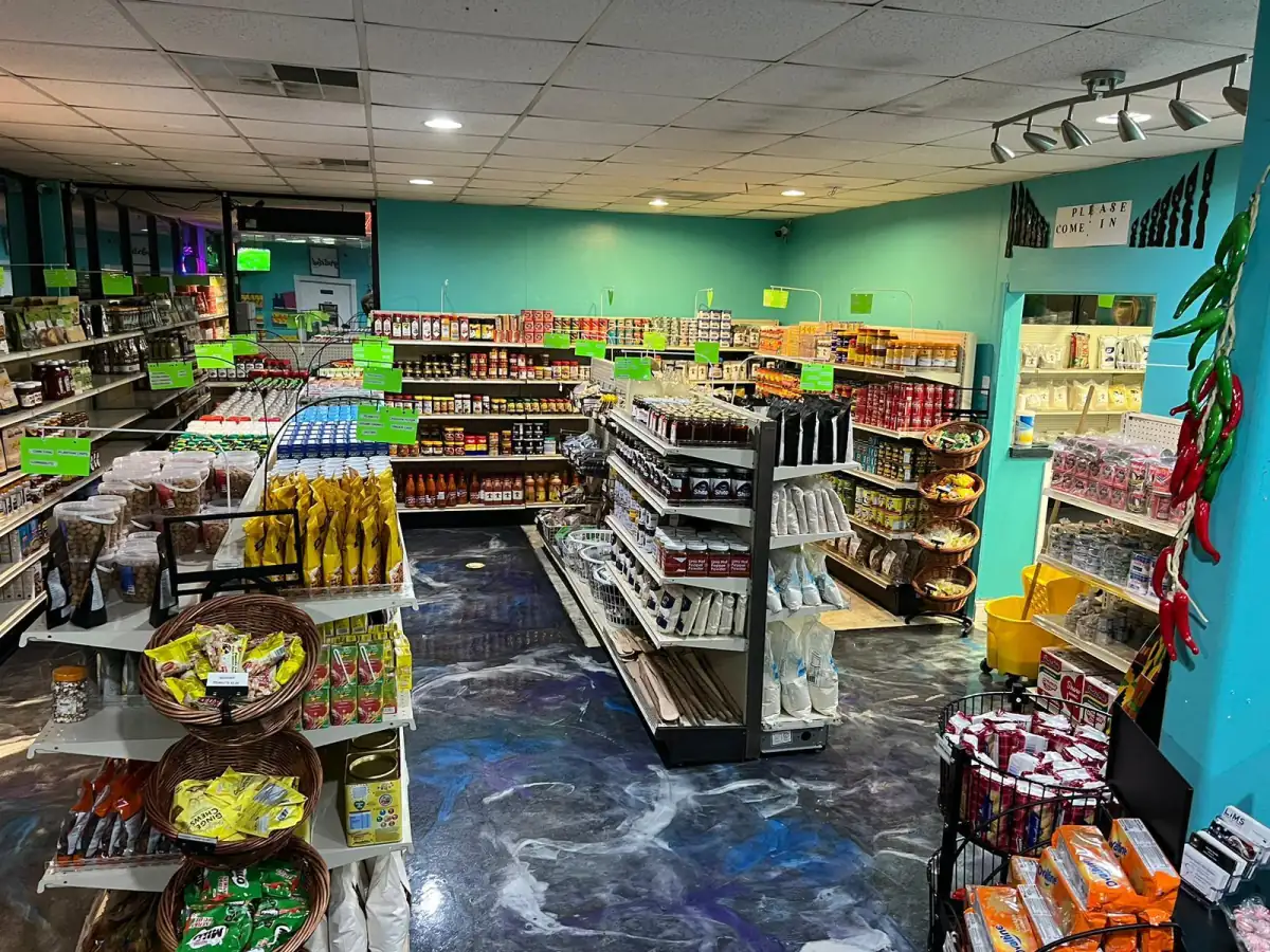 Interior of LIMS Makola International Market with stocked grocery aisles in Hagerstown.
